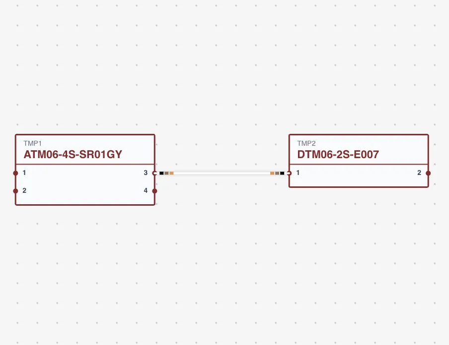 A wire connection between two connector cavities with cavity labels and wire color visible